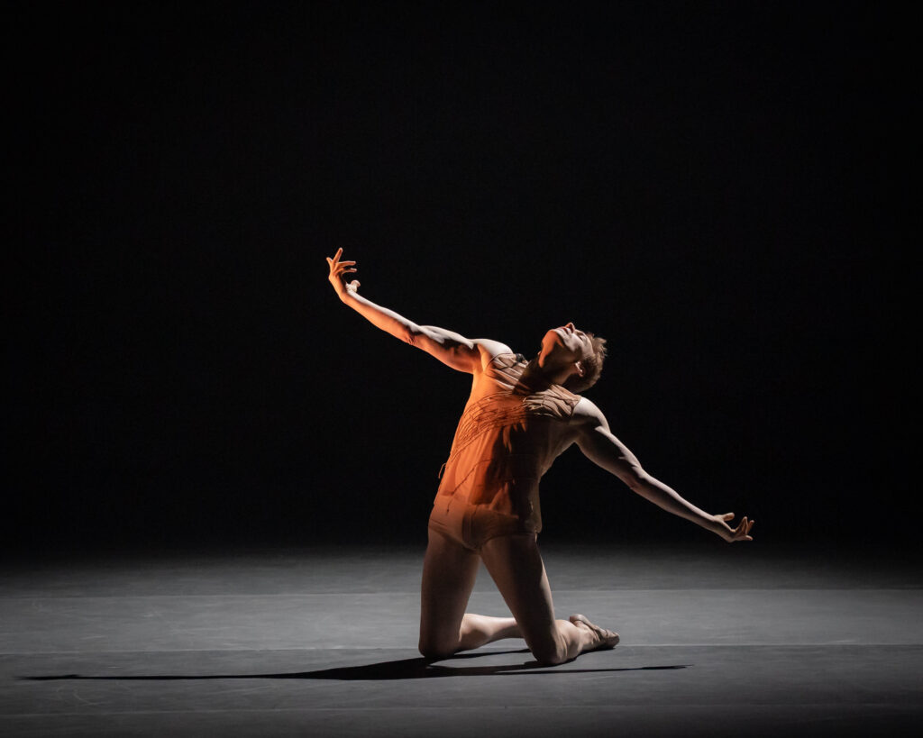Edward Watson kneels in Asylum