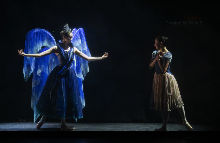 Cinderella's Fairy Godmother is stylishly dressed in blue with largw wings and a glittering diadem