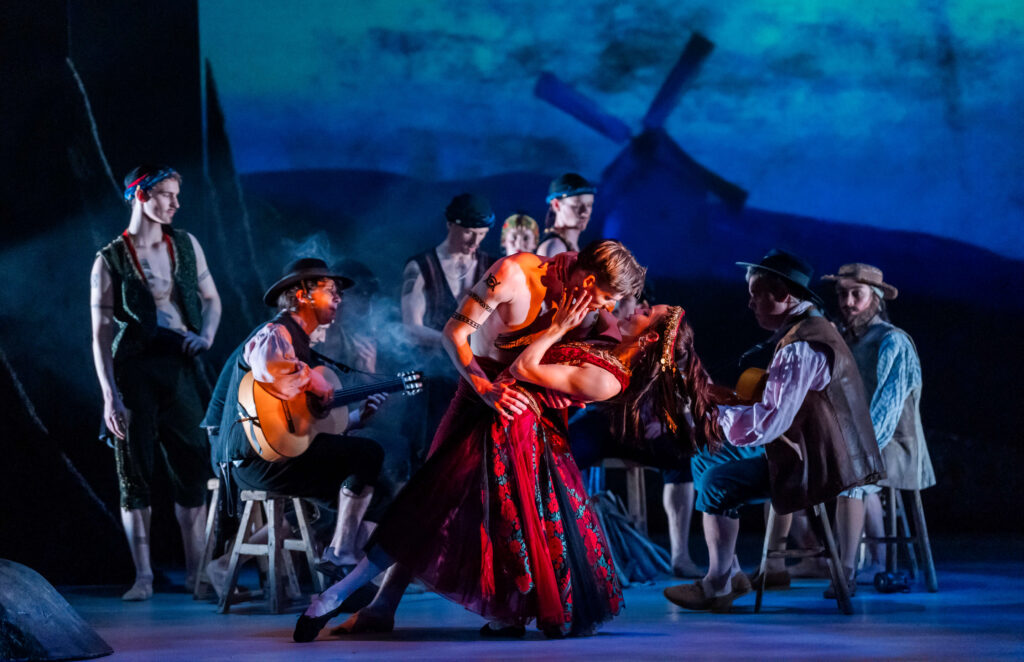 A steamy pas deux in the Act II scene in the gypsy camp, with two on-stage guitarists siting around the camp fire
